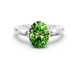 White gold Oval Cut Cut Diamond Ring with Tapered Baguette Side Stones in Four-Prong Setting