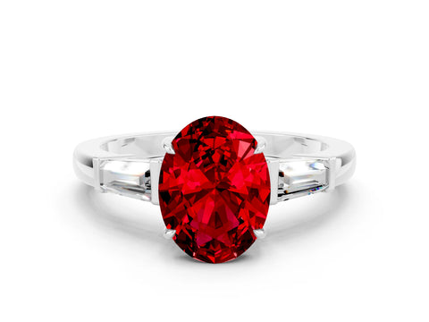 White gold Oval Cut Cut Diamond Ring with Tapered Baguette Side Stones in Four-Prong Setting