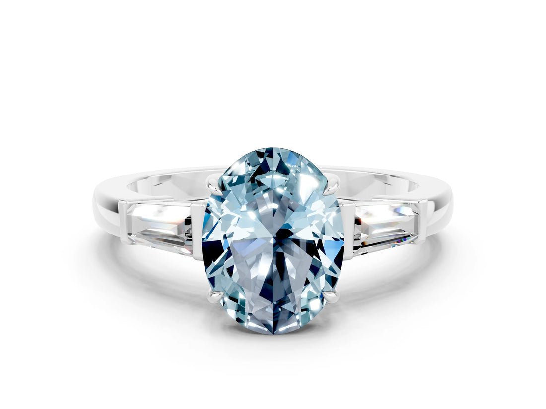 White gold Oval Cut Cut Diamond Ring with Tapered Baguette Side Stones in Four-Prong Setting