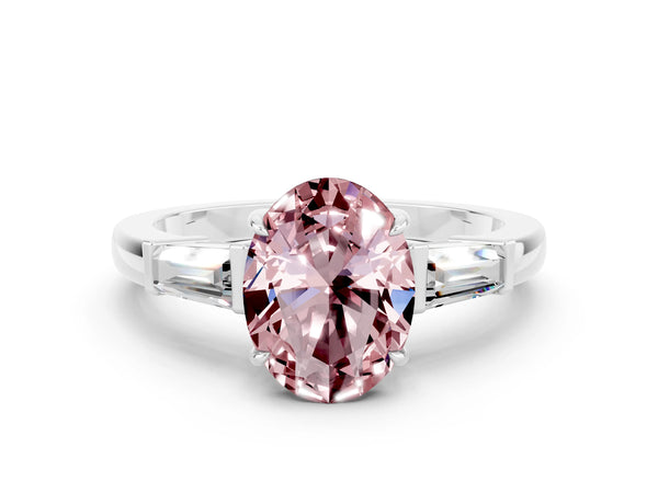 White gold Oval Cut Cut Diamond Ring with Tapered Baguette Side Stones in Four-Prong Setting