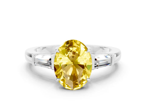 White gold Oval Cut Cut Diamond Ring with Tapered Baguette Side Stones in Four-Prong Setting