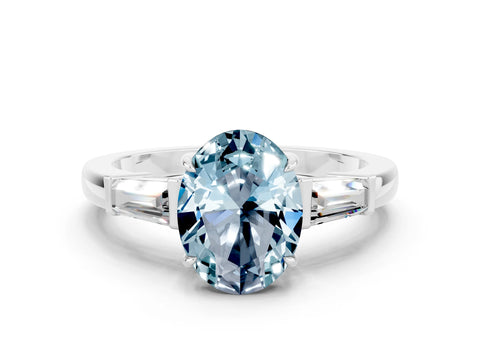 White gold Oval Cut Cut Diamond Ring with Tapered Baguette Side Stones in Four-Prong Setting