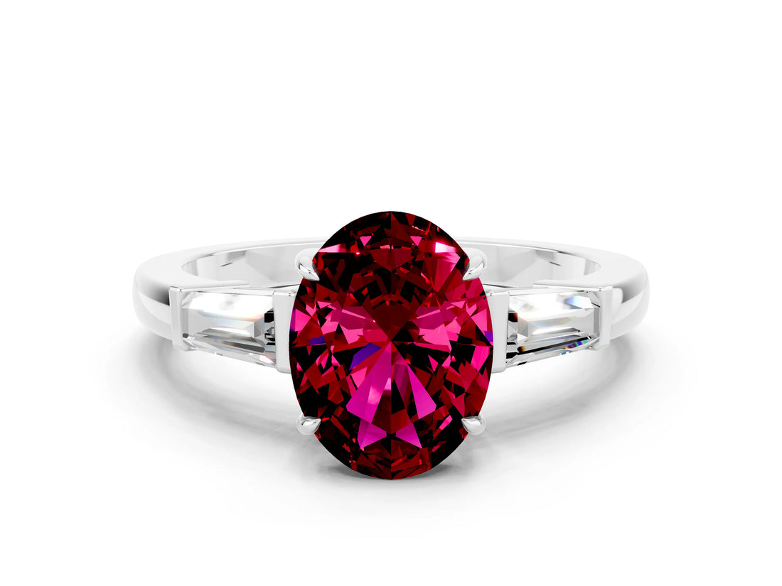 White gold Oval Cut Cut Diamond Ring with Tapered Baguette Side Stones in Four-Prong Setting