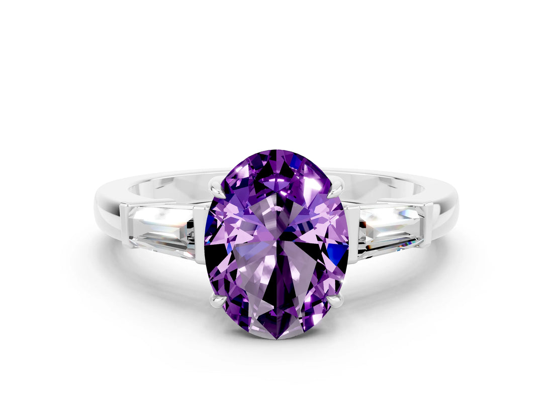 White gold Oval Cut Cut Diamond Ring with Tapered Baguette Side Stones in Four-Prong Setting