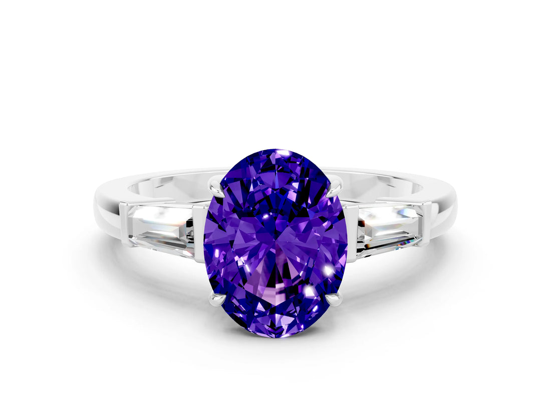 White gold Oval Cut Cut Diamond Ring with Tapered Baguette Side Stones in Four-Prong Setting