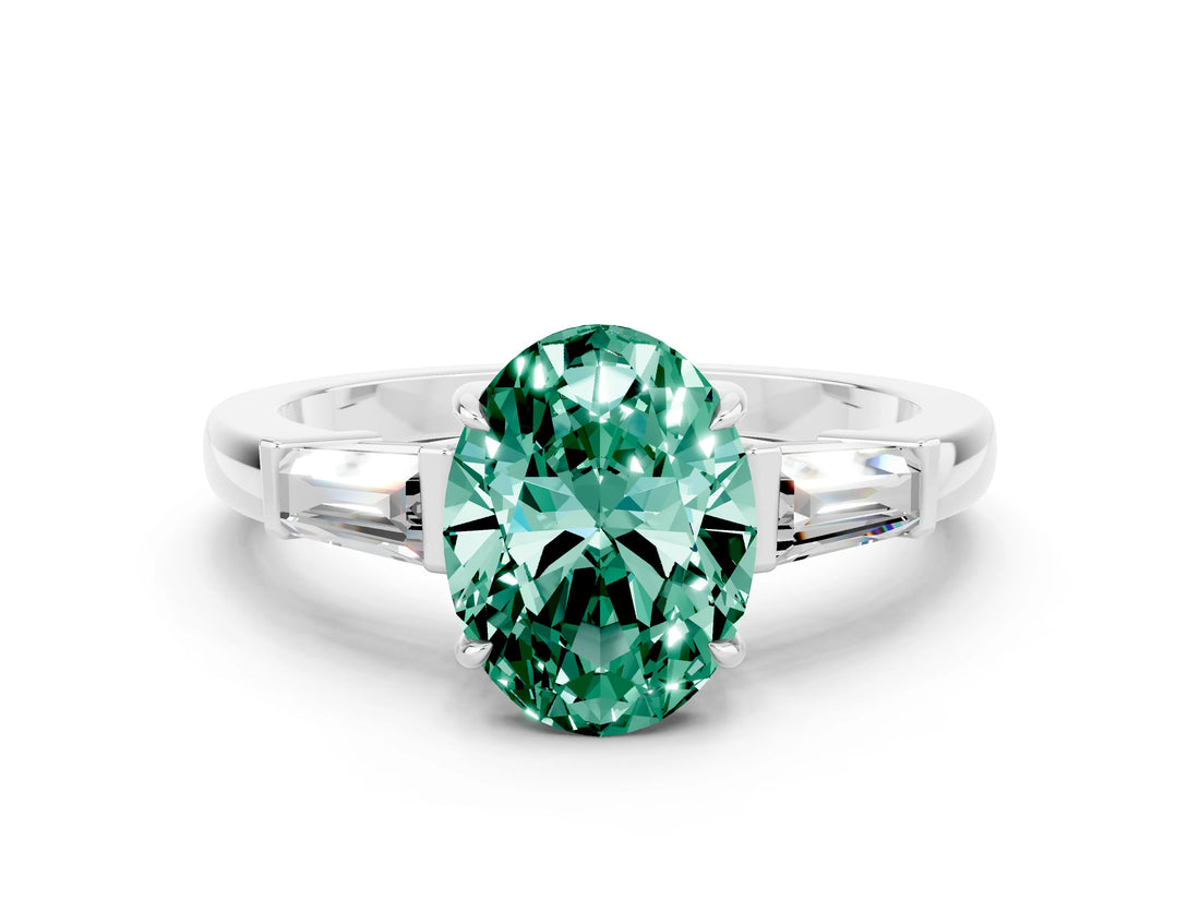 White gold Oval Cut Cut Diamond Ring with Tapered Baguette Side Stones in Four-Prong Setting