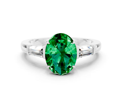 White gold Oval Cut Cut Diamond Ring with Tapered Baguette Side Stones in Four-Prong Setting
