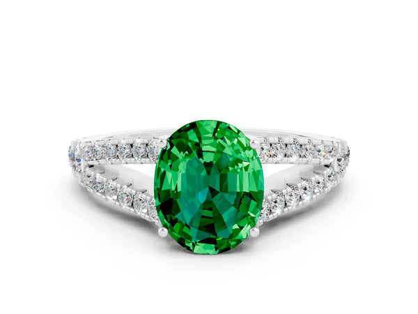 Platinum Oval Cut Emerald Split Shank Engagement Ring with Round Pavé and Prong Setting