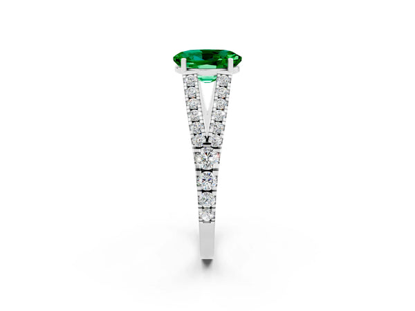 Platinum Oval Cut Emerald Split Shank Engagement Ring with Round Pavé and Prong Setting