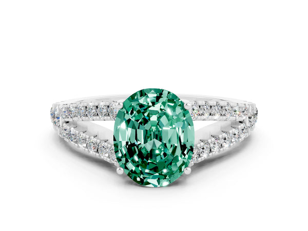 Platinum Oval Cut Green Sapphire Split Shank Engagement Ring with Round Pavé and Prong Setting