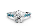 White gold Oval Cut Diamond Cathedral Solitaire Ring with Round with Blue Topaz side stone Pavé Band