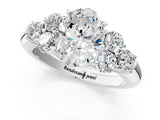 White gold Oval Cut Diamond Cluster Ring with Round Accent Stones and Prong Setting on a Classic Band_97