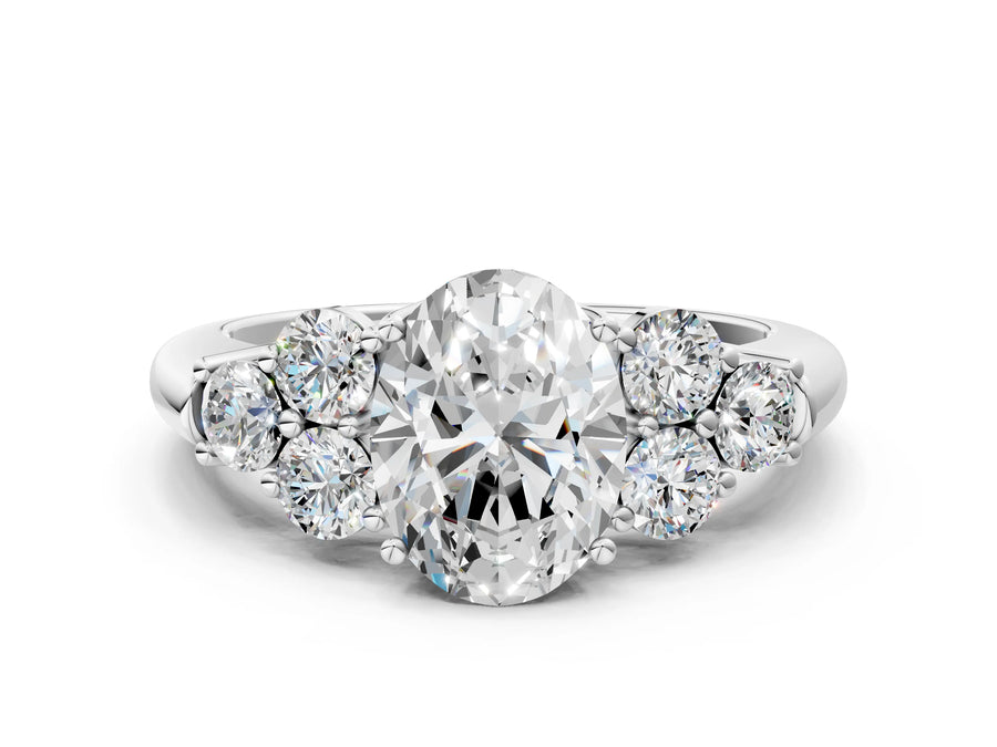 White gold Oval Cut Diamond Cluster Ring with Round Accent Stones and Prong Setting on a Classic Band