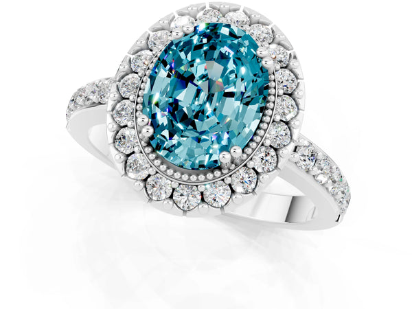 Silver Oval Cut Blue Topaz Halo Ring with Pavé Band and Prong Setting