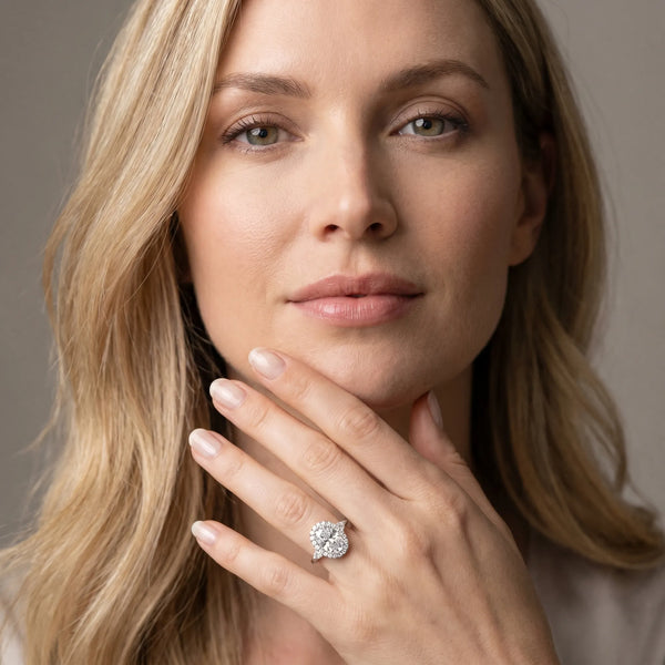 White gold Oval Cut Diamond Halo Ring with Pear Side Stones and Prong Setting