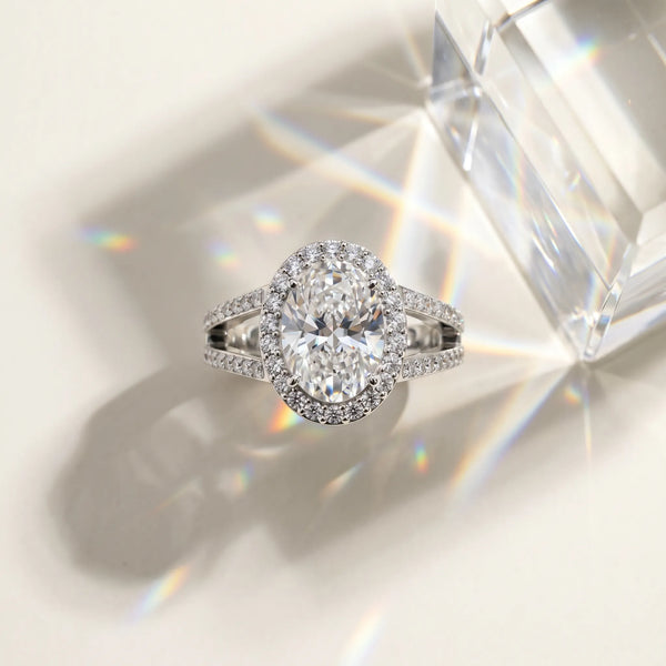 White gold Oval Cut Diamond Halo Ring with Split Shank U-Prong Band and Four-Prong Setting