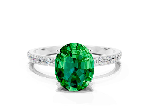 Silver Oval Cut Emerald Solitaire Ring with Round Pavé Shoulders and Prong Setting