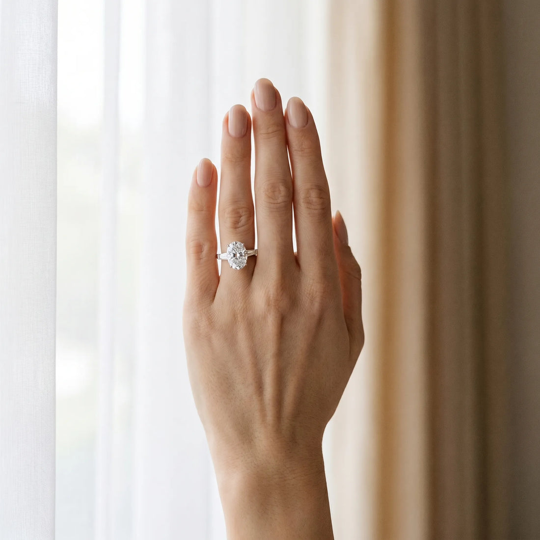 White gold Oval Cut Diamond Ring with Baguette Side Stones, Channel Set Band, and Four-Prong Setting_13