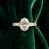 White gold Oval Cut Diamond Ring with Baguette Side Stones, Channel Set Band, and Four-Prong Setting_16