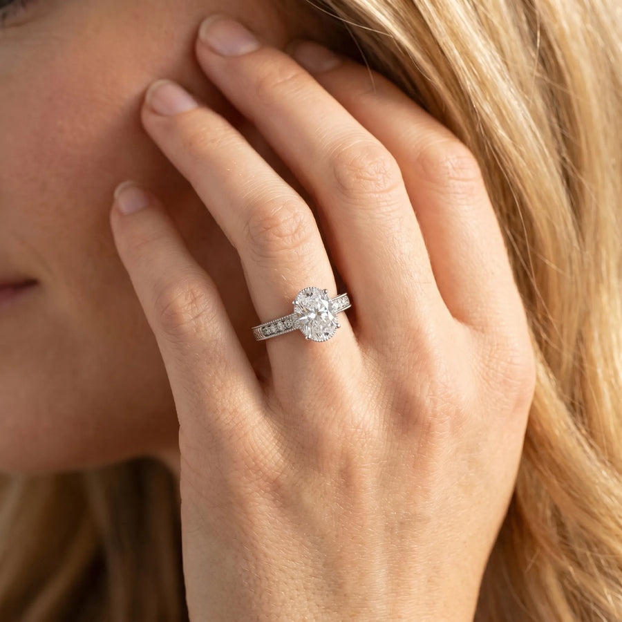 White gold Oval Cut Diamond Ring with Milgrain Pavé Band and Four-Prong Setting