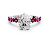 White gold Oval Cut Diamond Side Stone Solitaire Ring with Round with Garnet side stone and Four-Prong Setting