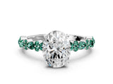 White gold Oval Cut Diamond Side Stone Solitaire Ring with Round with Green Sapphire side stone and Four-Prong Setting