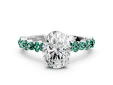 White gold Oval Cut Diamond Side Stone Solitaire Ring with Round with Green Sapphire side stone and Four-Prong Setting