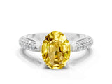White gold Oval Cut Diamond Solitaire Engagement Ring with Pavé Band and Four-Prong Setting
