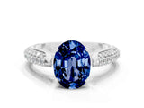 White gold Oval Cut Diamond Solitaire Engagement Ring with Pavé Band and Four-Prong Setting