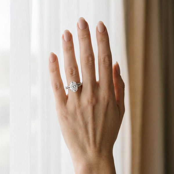 White gold Oval Cut Diamond Solitaire Engagement Ring with Twisted Pavé Band and Four-Prong Setting