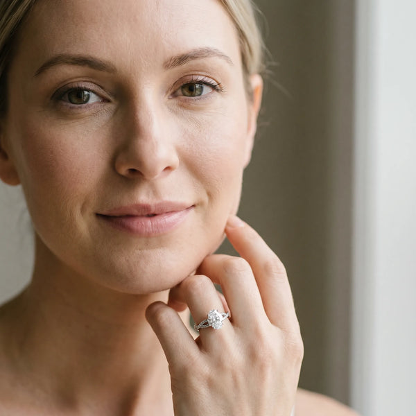 White gold Oval Cut Diamond Solitaire Engagement Ring with Twisted Pavé Band and Four-Prong Setting