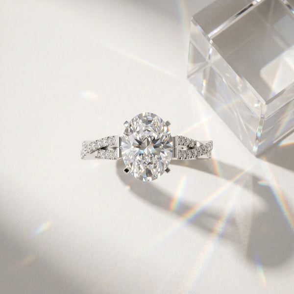 White gold Oval Cut Diamond Solitaire Engagement Ring with Twisted Pavé Band and Four-Prong Setting