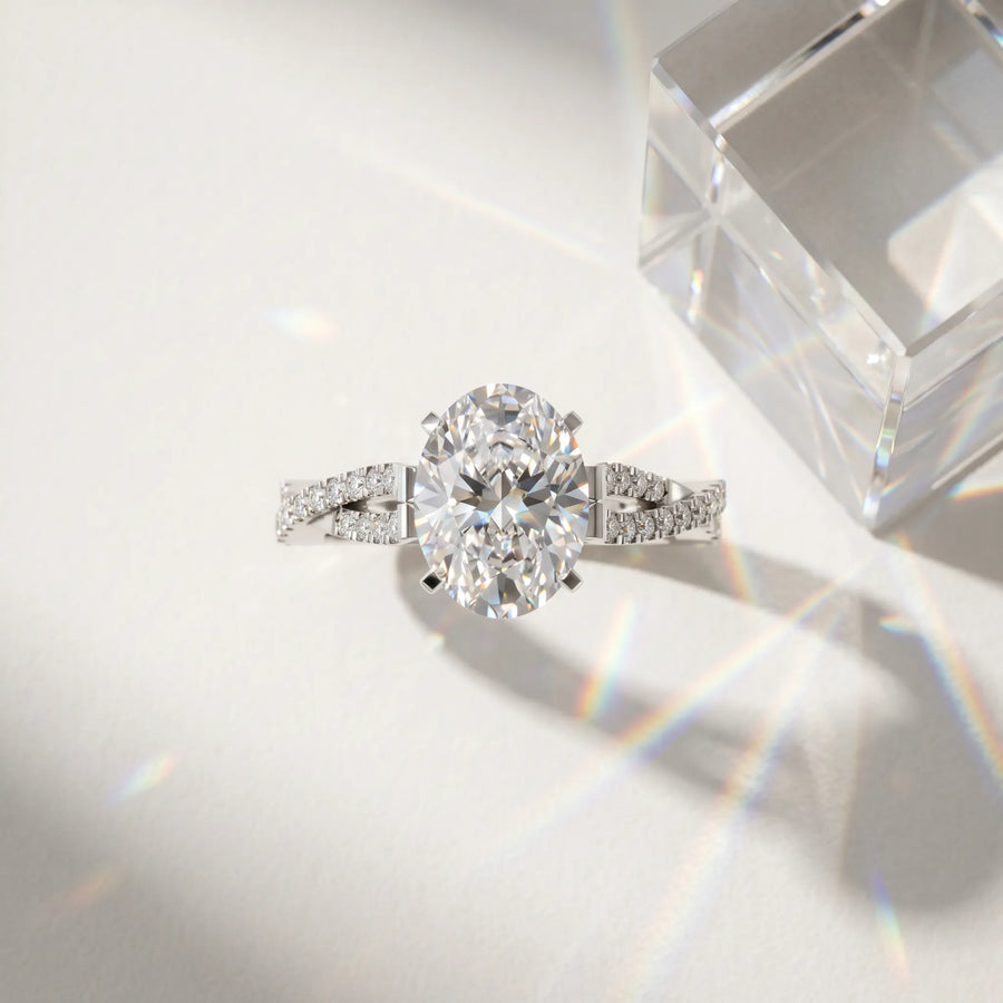 White gold Oval Cut Diamond Solitaire Engagement Ring with Twisted Pavé Band and Four-Prong Setting