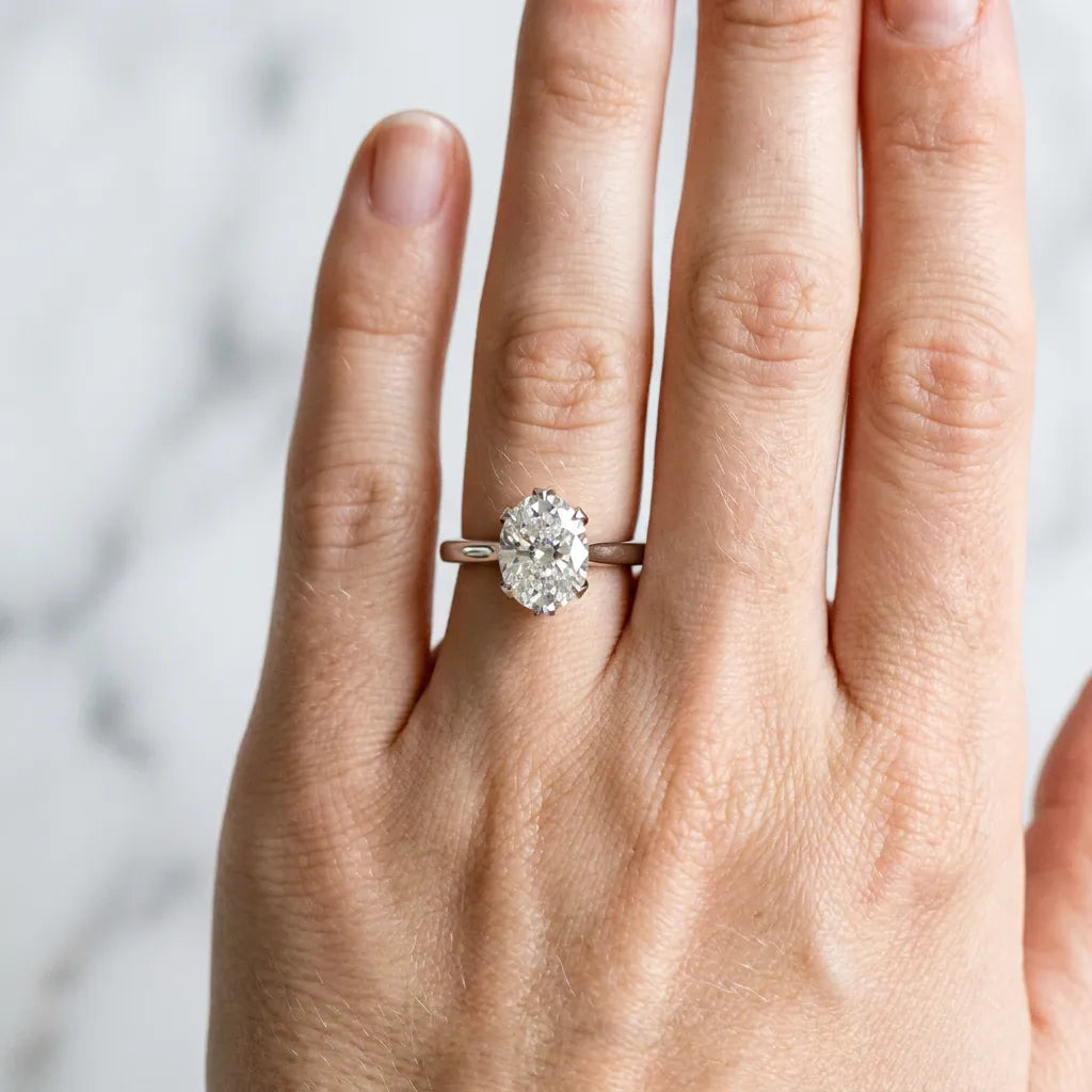 White gold Oval Cut Diamond Solitaire Ring with Flower Prong Setting and Classic Band_316