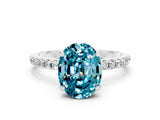White gold Oval Cut Diamond Solitaire Ring with Four-Prong Setting and Pavé Band