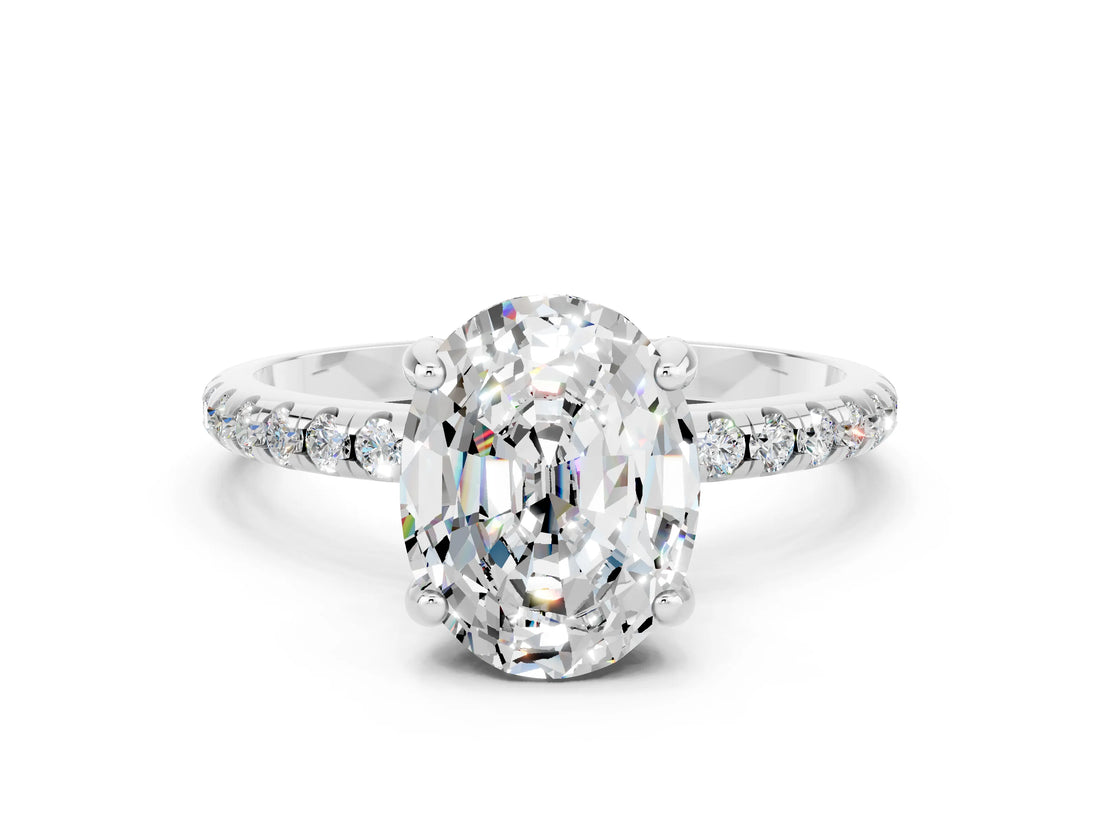 White gold Oval Cut Diamond Solitaire Ring with Four-Prong Setting and Pavé Band