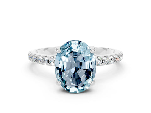 White gold Oval Cut Diamond Solitaire Ring with Four-Prong Setting and Pavé Band