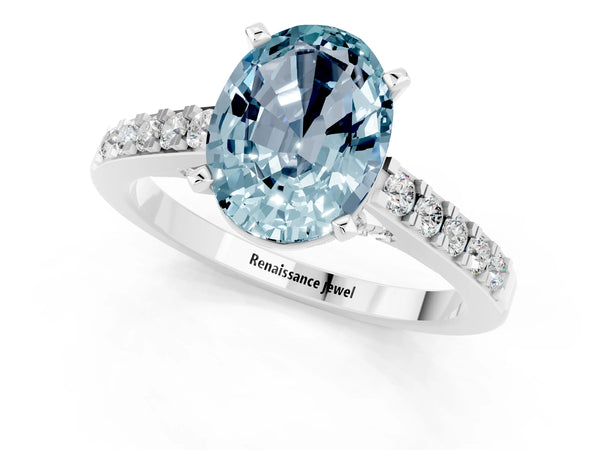 Platinum Oval Cut Aquamarine Solitaire Ring with Crossover Gallery and Round  Pavé Band