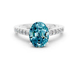 White gold Oval Cut Diamond Solitaire Ring with Pavé Band and Prong Setting