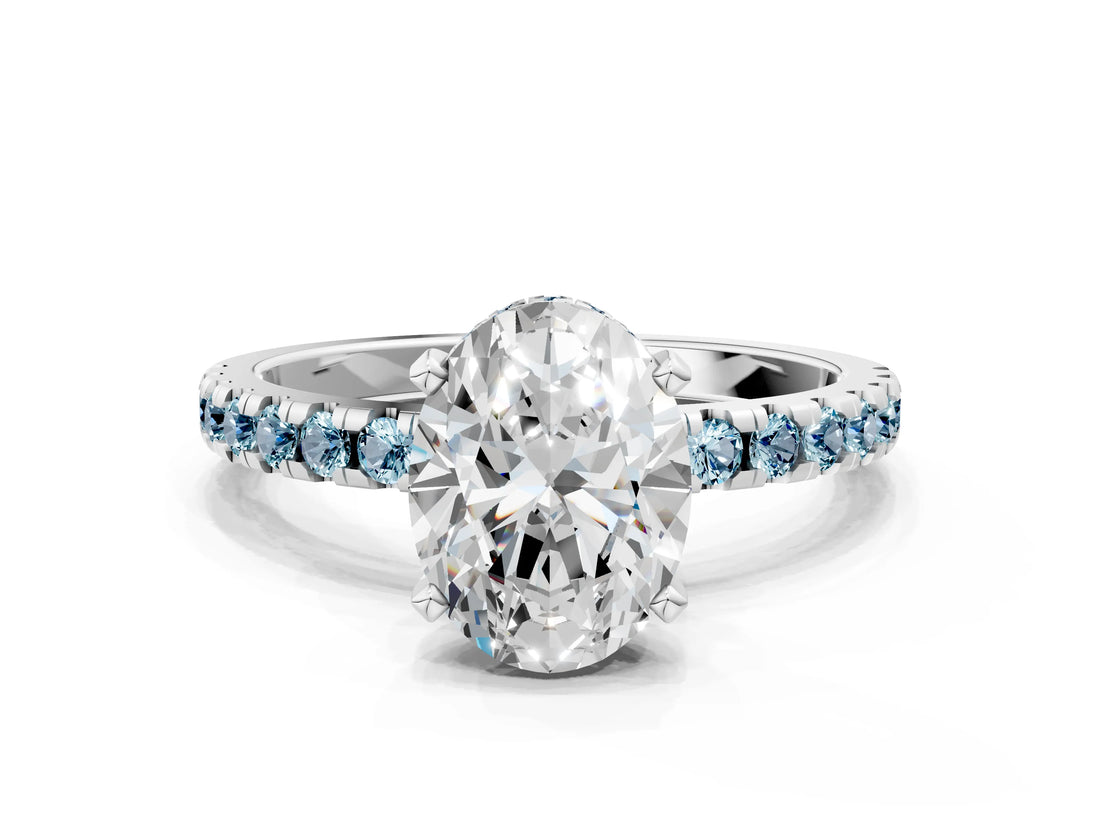 White gold Oval Cut Diamond Solitaire Ring with Round with Aquamarine side stone Pavé Band and Four-Prong Setting