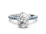 White gold Oval Cut Diamond Solitaire Ring with Round with Aquamarine side stone Pavé Band and Four-Prong Setting
