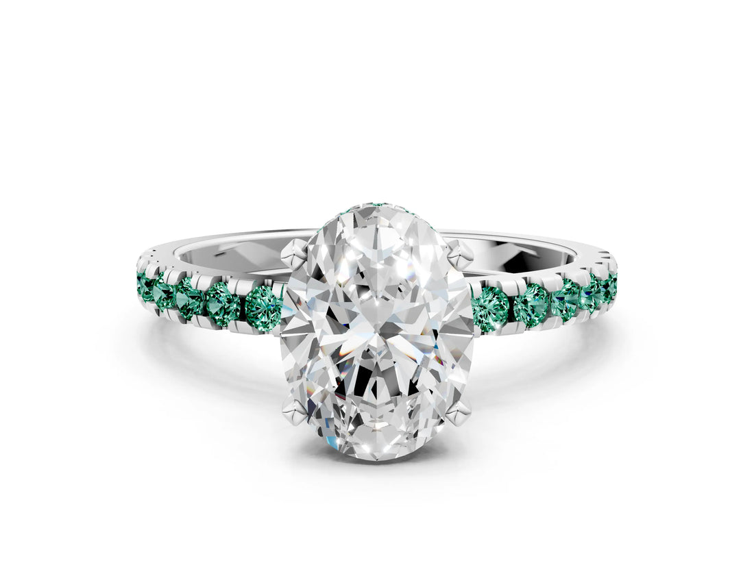 White gold Oval Cut Diamond Solitaire Ring with Round with Green Sapphire side stone Pavé Band and Four-Prong Setting