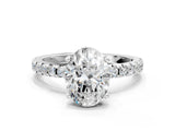 White gold Oval Cut Diamond Solitaire Ring with Round with Moissanite side stone Pavé Band and Four-Prong Setting_12