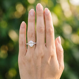 White gold Oval Cut Diamond Solitaire Ring with Side Stones and Four-Prong Setting_99