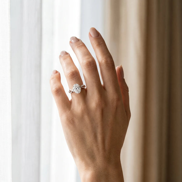 White gold Oval Cut Diamond Solitaire Ring with Twisted Band and Prong Setting