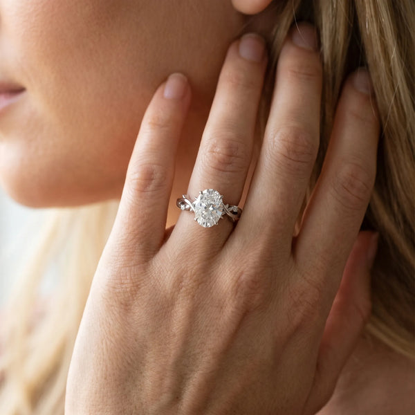 White gold Oval Cut Diamond Solitaire Ring with Twisted Band and Prong Setting