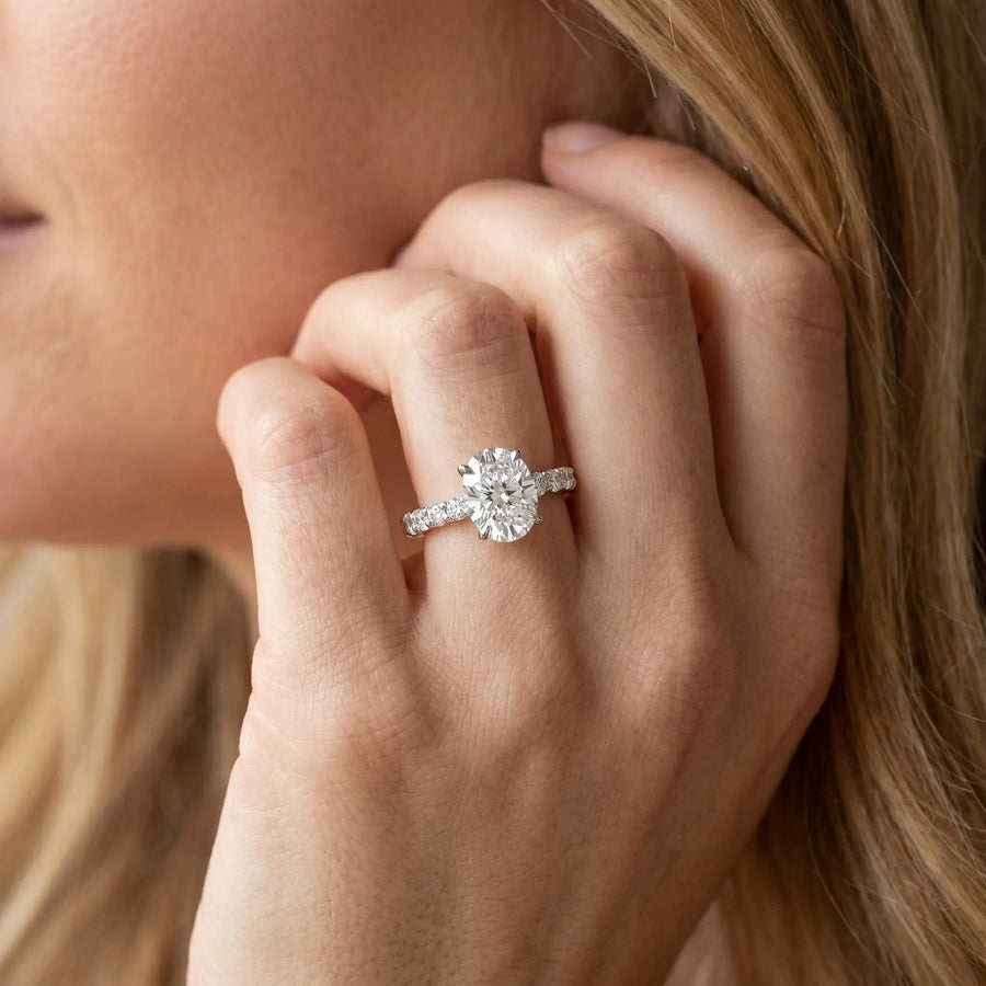 White gold Oval Cut Diamond Solitaire Ring with U-Prong Diamond Band and Four Prong Setting