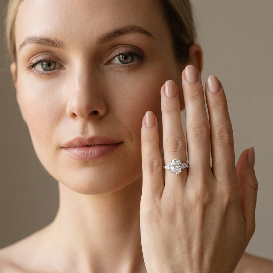 White gold Oval Cut Diamond Three-Stone Ring with Pear  Side Stones and Prong Setting
