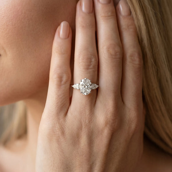 White gold Oval Cut Diamond Three-Stone Ring with Pear  Side Stones and Prong Setting