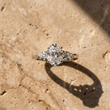 White gold Oval Cut Diamond Three-Stone Ring with Pear Side Stones and Four-Prong Setting_158
